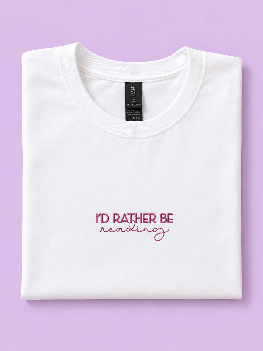 I'd Rather Be Reading white t-shirt folded showing embroidered detail