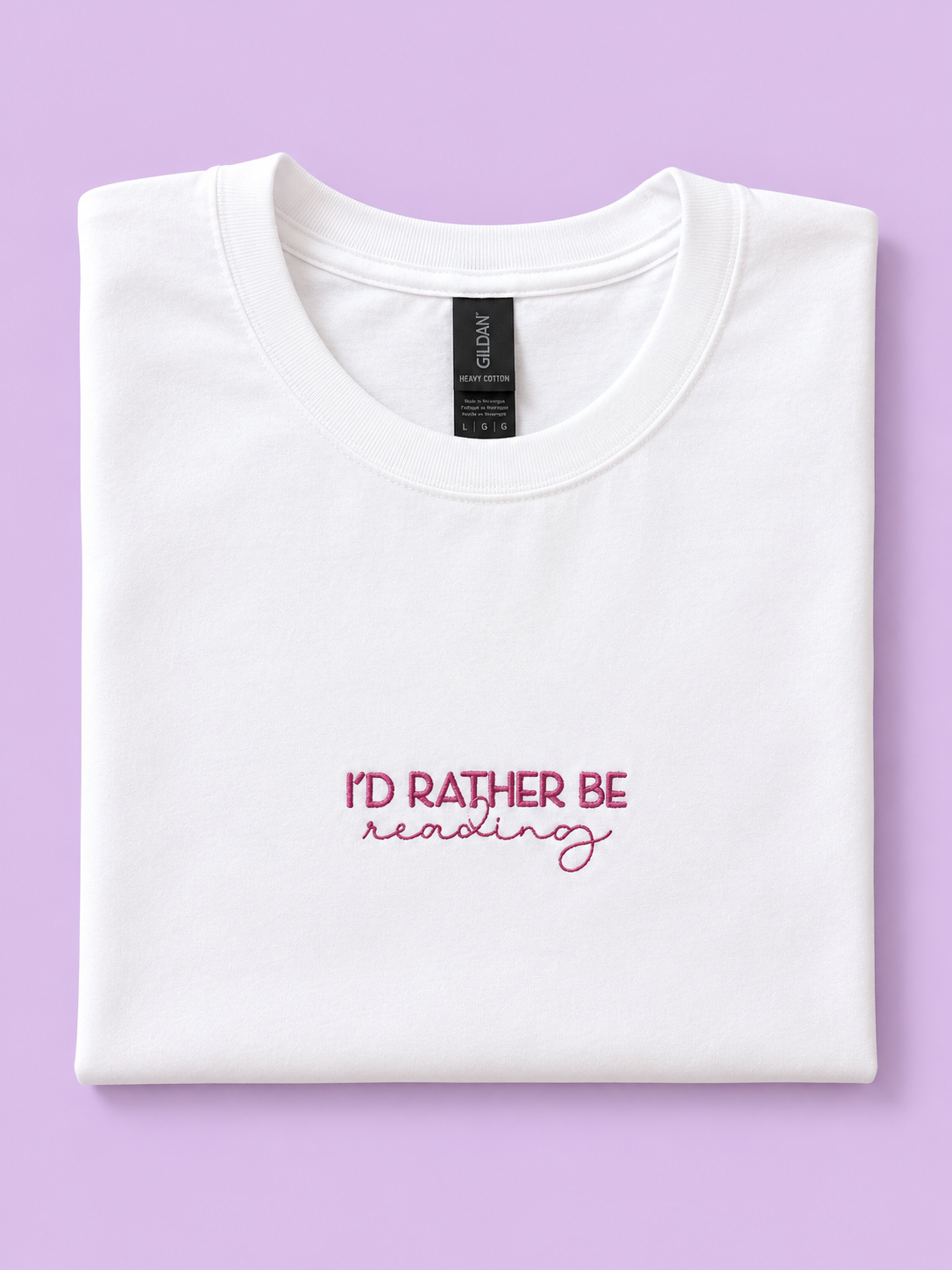 I'd Rather Be Reading white t-shirt folded showing embroidered detail