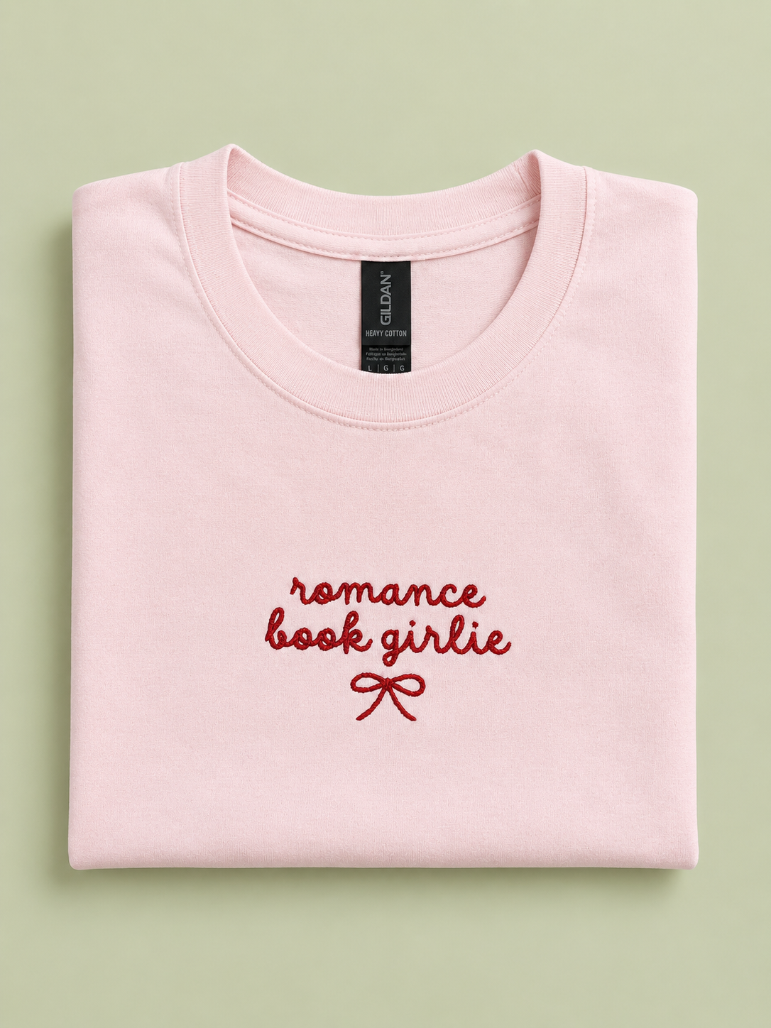 Romance Book Girlie pink t-shirt folded showing embroidered detail